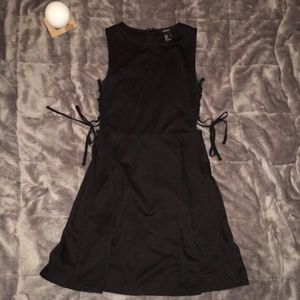 Simple black dress with side slits that tie up